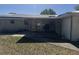 Covered patio area with access to the yard at 916 Kentucky St, Haines City, FL 33844