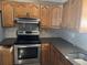 Wood cabinets with stainless steel appliances at 916 Kentucky St, Haines City, FL 33844