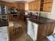 Traditional kitchen with granite countertops, stainless steel appliances, and oak cabinetry at 916 Kentucky St, Haines City, FL 33844