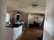 Spacious living room featuring hard floors, an island, and ceiling fans at 916 Kentucky St, Haines City, FL 33844