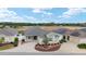 Aerial view of the home featuring mature landscaping, ample parking, and inviting curb appeal at 9181 Se 166Th Sprung Ln, The Villages, FL 32162