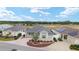 Aerial view showing the home with a circular driveway, landscaping, and neighboring houses at 9181 Se 166Th Sprung Ln, The Villages, FL 32162