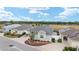Aerial shot showcasing a well-maintained home with professional landscaping and a manicured lawn at 9181 Se 166Th Sprung Ln, The Villages, FL 32162