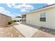 View of the home's backyard featuring a concrete patio and low-maintenance landscaping at 9181 Se 166Th Sprung Ln, The Villages, FL 32162