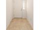 Tiled foyer area with a white door featuring a sidelight and white trim at 9181 Se 166Th Sprung Ln, The Villages, FL 32162
