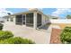 The home has a screened lanai and a concrete patio at 9181 Se 166Th Sprung Ln, The Villages, FL 32162
