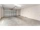 A spacious garage with an automatic door and plenty of room for storage at 9181 Se 166Th Sprung Ln, The Villages, FL 32162