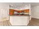 Kitchen with stainless steel appliances, granite countertops, and wood cabinets at 9181 Se 166Th Sprung Ln, The Villages, FL 32162