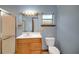 Bathroom featuring vanity, shower and mirror with great lighting at 9236 County Road 48, Yalaha, FL 34797