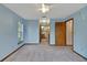 Open bedroom layout with windows, carpet flooring and en-suite bath access at 9236 County Road 48, Yalaha, FL 34797