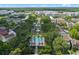Aerial view of a real estate complex with a pool, palm trees and parking spaces at 1021 Siena Park Blvd # 204, Kissimmee, FL 34747