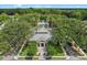 Aerial view of clubhouse, landscaping, pool, palm trees, and parking at 1021 Siena Park Blvd # 204, Kissimmee, FL 34747