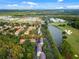 Aerial view featuring community, pond, and golf course at 1021 Siena Park Blvd # 204, Kissimmee, FL 34747
