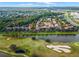 Community aerial showcasing golf course, pond, and surrounding neighborhood at 1021 Siena Park Blvd # 204, Kissimmee, FL 34747