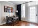Dining area with four seats, hardwood floors, and natural lighting at 1021 Siena Park Blvd # 204, Kissimmee, FL 34747
