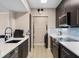Well-equipped kitchen featuring stainless steel appliances, and easy access to an in-unit washer and dryer at 1021 Siena Park Blvd # 204, Kissimmee, FL 34747