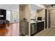 Open concept kitchen area with stainless steel appliances and a clear view into the spacious living room at 1021 Siena Park Blvd # 204, Kissimmee, FL 34747
