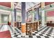 This lobby bar features high top seating and stylish checkered floors at 1021 Siena Park Blvd # 204, Kissimmee, FL 34747