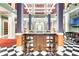 This lobby bar features high top seating and stylish checkered floors at 1021 Siena Park Blvd # 204, Kissimmee, FL 34747