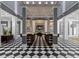 Spacious lobby with black and white tile, offering comfortable seating and a welcoming atmosphere at 1021 Siena Park Blvd # 204, Kissimmee, FL 34747