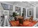 Well-appointed community lobby with comfortable seating, stylish rug, and a welcoming atmosphere at 1021 Siena Park Blvd # 204, Kissimmee, FL 34747