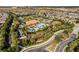 Aerial view of the community amenities including tennis courts, pool, and clubhouse at 1027 Timbervale Trl, Clermont, FL 34715