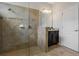 Bathroom boasts tiled walk-in shower, modern fixtures, and granite vanity at 1027 Timbervale Trl, Clermont, FL 34715