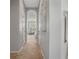 Neutral hallway leading into bedroom with plush carpet at 1027 Timbervale Trl, Clermont, FL 34715