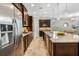 Beautiful kitchen featuring granite countertops, stainless steel appliances, and dark wood cabinets at 1027 Timbervale Trl, Clermont, FL 34715