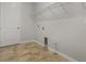 Unfurnished laundry room with tile floor and upper shelving at 1027 Timbervale Trl, Clermont, FL 34715