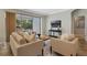 Cozy living room features comfortable seating, a wooden coffee table, and a sliding glass door to the outdoors at 1027 Timbervale Trl, Clermont, FL 34715