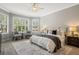 Bright main bedroom featuring neutral decor and a large window at 1027 Timbervale Trl, Clermont, FL 34715