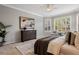 Inviting bedroom with sitting area, plantation shutters, and soft natural light at 1027 Timbervale Trl, Clermont, FL 34715