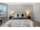 Spacious main bedroom featuring large bed with lamps and grey blanket at 1027 Timbervale Trl, Clermont, FL 34715