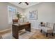 Inviting office space with a wooden desk, comfortable chair, and soothing decor for productivity at 1027 Timbervale Trl, Clermont, FL 34715