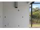 Screened-in patio featuring stucco walls and ample electrical outlets at 1027 Timbervale Trl, Clermont, FL 34715