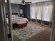 Comfortable bedroom featuring neutral colors, ceiling fan, and natural light at 1033 N Jacks Lake Rd, Clermont, FL 34711