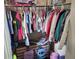 Walk-in closet with colorful clothing, shelving, and ample storage space at 1033 N Jacks Lake Rd, Clermont, FL 34711