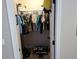 Features a walk-in closet with clothing rack and shoe rack at 1033 N Jacks Lake Rd, Clermont, FL 34711