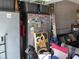 Finished garage with sports decor, a couch, and some storage at 1033 N Jacks Lake Rd, Clermont, FL 34711