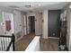 Upstairs hallway leading to various rooms, providing a seamless flow throughout the upper level at 1033 N Jacks Lake Rd, Clermont, FL 34711