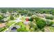 Overhead view of a home on a large lot with mature trees in a serene neighborhood, highlighting privacy and space at 10465 Se 41St Ter, Belleview, FL 34420