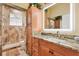 Stylish bathroom featuring granite countertops, modern fixtures, and a glass shower at 10465 Se 41St Ter, Belleview, FL 34420
