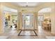 Inviting foyer with decorative tile, a view into the living room and dining room, and natural light at 10465 Se 41St Ter, Belleview, FL 34420
