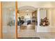 Elegant foyer featuring tile flooring, a decorative glass door, and a view into the spacious living area at 10465 Se 41St Ter, Belleview, FL 34420