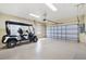 Spacious two-car garage with a golf cart at 10465 Se 41St Ter, Belleview, FL 34420