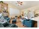 Bright living room boasts vaulted ceilings, a stone fireplace, hardwood floors, and an entertainment center at 10465 Se 41St Ter, Belleview, FL 34420