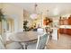 Open-concept layout with a breakfast nook, living space, and kitchen with bar seating at 10465 Se 41St Ter, Belleview, FL 34420
