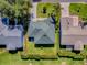 Aerial view outlining property lines, showcasing the home's location, landscaping, and roof at 1060 Davenport Dr, The Villages, FL 32162