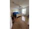 Well-lit bedroom with neutral walls, a queen-sized bed, and tile floors at 1060 Davenport Dr, The Villages, FL 32162